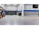 Well-organized garage equipped with custom cabinets, epoxy flooring, and integrated storage solutions at 22477 S 197Th Cir, Queen Creek, AZ 85142