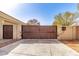 Private driveway with an automatic gate, offering security and enhancing the property's appeal at 22477 S 197Th Cir, Queen Creek, AZ 85142