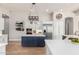 Modern kitchen featuring white cabinets, a blue island, stainless steel appliances, and ample counter space at 22477 S 197Th Cir, Queen Creek, AZ 85142
