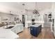 Bright, open kitchen featuring white cabinetry, a center island, and modern stainless steel appliances at 22477 S 197Th Cir, Queen Creek, AZ 85142