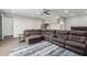Cozy living space featuring a kitchenette, large sectional sofa, and modern furnishings at 22477 S 197Th Cir, Queen Creek, AZ 85142