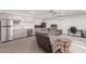 Relaxing living area with kitchenette and comfortable seating, ideal for casual gatherings and movie nights at 22477 S 197Th Cir, Queen Creek, AZ 85142