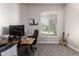 Bright office space features a large window, plantation shutters, and ample workspace at 22477 S 197Th Cir, Queen Creek, AZ 85142