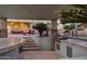 Inviting outdoor kitchen with bar, grill, and lounge area perfect for entertaining at 22477 S 197Th Cir, Queen Creek, AZ 85142