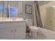 Clean bathroom with shower/tub combo and updated vanity at 22488 N Mulligan Dr, Maricopa, AZ 85138