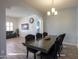 Open concept dining room with a view into the living room at 22488 N Mulligan Dr, Maricopa, AZ 85138