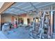 Home gym with weight machine and punching bag at 22488 N Mulligan Dr, Maricopa, AZ 85138