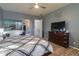 Spacious main bedroom with king-size bed and en-suite bathroom at 22488 N Mulligan Dr, Maricopa, AZ 85138
