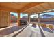 Covered patio with built-in BBQ and seating area at 22488 N Mulligan Dr, Maricopa, AZ 85138