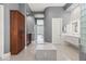 Modern bathroom with double vanity and walk-in closet at 23238 N 94Th Pl, Scottsdale, AZ 85255