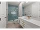Modern bathroom with blue tile shower and floating vanity at 23238 N 94Th Pl, Scottsdale, AZ 85255