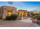 Elegant home exterior with desert landscaping and a welcoming entryway at 23238 N 94Th Pl, Scottsdale, AZ 85255