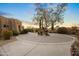 Circular driveway and courtyard with desert landscaping at 23238 N 94Th Pl, Scottsdale, AZ 85255