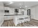 Modern kitchen with white cabinets and a large island at 23238 N 94Th Pl, Scottsdale, AZ 85255