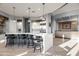 Modern kitchen with a large island, stainless steel appliances, and seating for four at 23238 N 94Th Pl, Scottsdale, AZ 85255