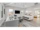 Bright and airy living room with comfortable seating and large windows at 23238 N 94Th Pl, Scottsdale, AZ 85255