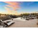 Luxury pool and spa with a scenic sunset view and comfortable lounge chairs at 23238 N 94Th Pl, Scottsdale, AZ 85255