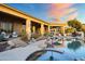 Stunning pool and spa area with a view of the home and desert landscape at 23238 N 94Th Pl, Scottsdale, AZ 85255