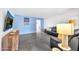 Living room features blue walls, gray couches, and a wood media console at 2444 E Del Rio Dr, Tempe, AZ 85282