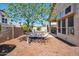 Spacious backyard featuring a hammock, patio with hot tub, and low-maintenance desert landscaping, perfect for outdoor enjoyment at 31016 N 42Nd Way, Cave Creek, AZ 85331
