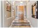Elegant foyer with wooden flooring, high ceilings, decorative mirror, and recessed lighting, creating a welcoming entrance at 31016 N 42Nd Way, Cave Creek, AZ 85331