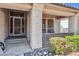 Inviting front porch with decorative rock, leading to a secure front door and offering a cozy outdoor space at 31016 N 42Nd Way, Cave Creek, AZ 85331