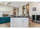 Open-concept living space featuring built-in shelving, dining area, and a view into the living room, ideal for Gathering gatherings at 31016 N 42Nd Way, Cave Creek, AZ 85331