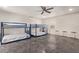 A bedroom furnished with two blue metal bunkbeds, a ceiling fan, and neutral decor at 3132 N 15Th Ave, Phoenix, AZ 85015