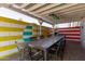 Outdoor patio with colorful wall art and dining set at 3132 N 15Th Ave, Phoenix, AZ 85015
