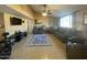 Living room with comfortable seating, large windows, and tile flooring at 3723 W Helena Dr, Glendale, AZ 85308