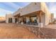 A spacious back patio offering multiple seating areas for entertaining at 37327 N 16Th St, Phoenix, AZ 85086