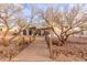 Scenic backyard view with a charming bridge and well-manicured desert landscaping at 37327 N 16Th St, Phoenix, AZ 85086