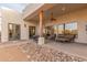 Expansive outdoor living area with comfortable seating and a built-in grill at 37327 N 16Th St, Phoenix, AZ 85086