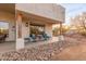 Relaxing back patio with seating area and charming outdoor lighting at 37327 N 16Th St, Phoenix, AZ 85086