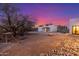 Backyard with fire pit and seating area, creating a cozy space for outdoor gatherings at 37327 N 16Th St, Phoenix, AZ 85086