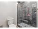 Sleek bathroom showcasing a glass enclosed shower with gray tile and a modern shower system at 37327 N 16Th St, Phoenix, AZ 85086