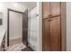 Bathroom view with an open shower, cabinet storage, and modern patterned flooring at 37327 N 16Th St, Phoenix, AZ 85086