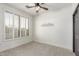 Bright, vacant bedroom with large window and plantation shutters offers ample natural light at 37327 N 16Th St, Phoenix, AZ 85086