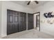 Well-lit vacant bedroom has a ceiling fan and direct access to a bathroom and walk-in closet at 37327 N 16Th St, Phoenix, AZ 85086