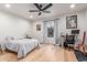 Spacious bedroom with hardwood floors, modern decor, and a comfortable workspace at 37327 N 16Th St, Phoenix, AZ 85086