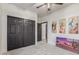 A second bedroom with a large closet, an exterior view, and a neutral carpet at 37327 N 16Th St, Phoenix, AZ 85086