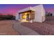 Charming home exterior with desert landscaping and covered entry with beautiful wood pillars at 37327 N 16Th St, Phoenix, AZ 85086