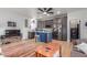 Open-concept living area with a modern kitchen, wood floors, and ample natural light at 37327 N 16Th St, Phoenix, AZ 85086