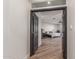View through a doorway into a bedroom, featuring wood flooring, a ceiling fan, and a decorative bed at 37327 N 16Th St, Phoenix, AZ 85086