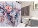 Cozy bathroom featuring a sink, toilet and a striking shower curtain for an eye-catching style at 41219 W Brandt Dr, Maricopa, AZ 85138