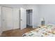 A secondary bedroom with a closet and access to the hallway at 41219 W Brandt Dr, Maricopa, AZ 85138