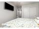 An overhead view from a bedroom featuring floral bedding and a mounted TV at 41219 W Brandt Dr, Maricopa, AZ 85138