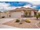Inviting single-story home with desert landscaping, neutral color scheme, and a spacious two-car garage at 41219 W Brandt Dr, Maricopa, AZ 85138