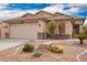 Inviting single-story home with desert landscaping, neutral color scheme, and a spacious two-car garage at 41219 W Brandt Dr, Maricopa, AZ 85138