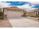 Inviting single-story home with desert landscaping, neutral color scheme, and a spacious two-car garage at 41219 W Brandt Dr, Maricopa, AZ 85138